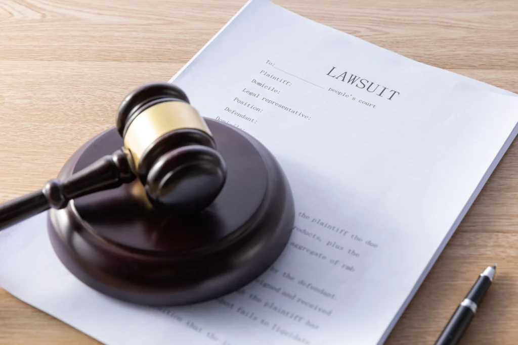 Gavel resting on legal documents, symbolizing a data breach lawsuit against a former employer in California.
