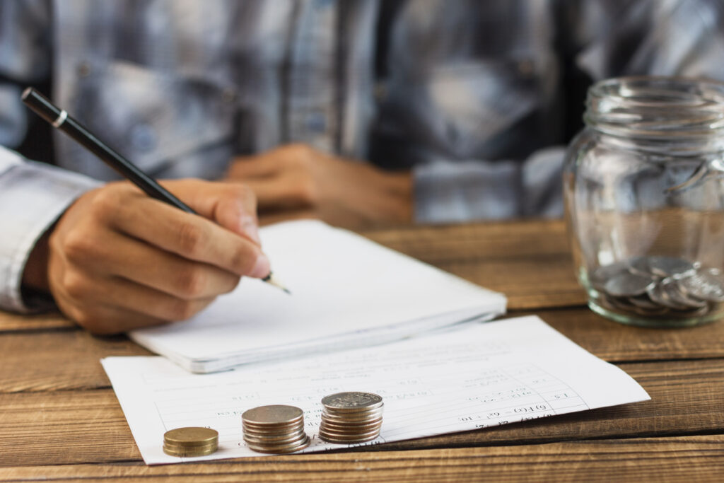 man with saving jar counting