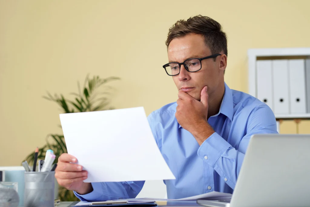 an employee reading his stay or pay agreemnts